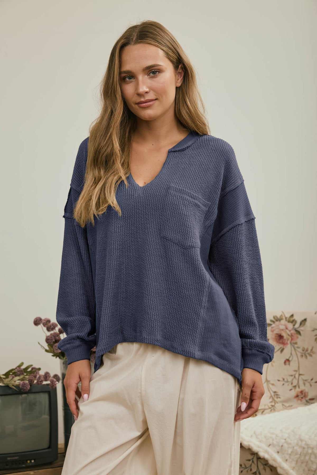 Split Neck Raw Edge Long Sleeve Ribbed Knit Top