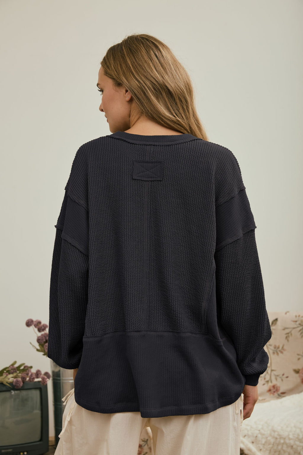 Split Neck Raw Edge Long Sleeve Ribbed Knit Top
